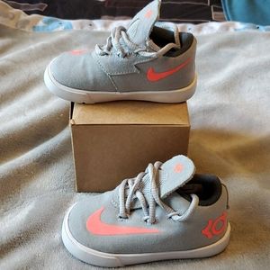 Gray and pink Nikes